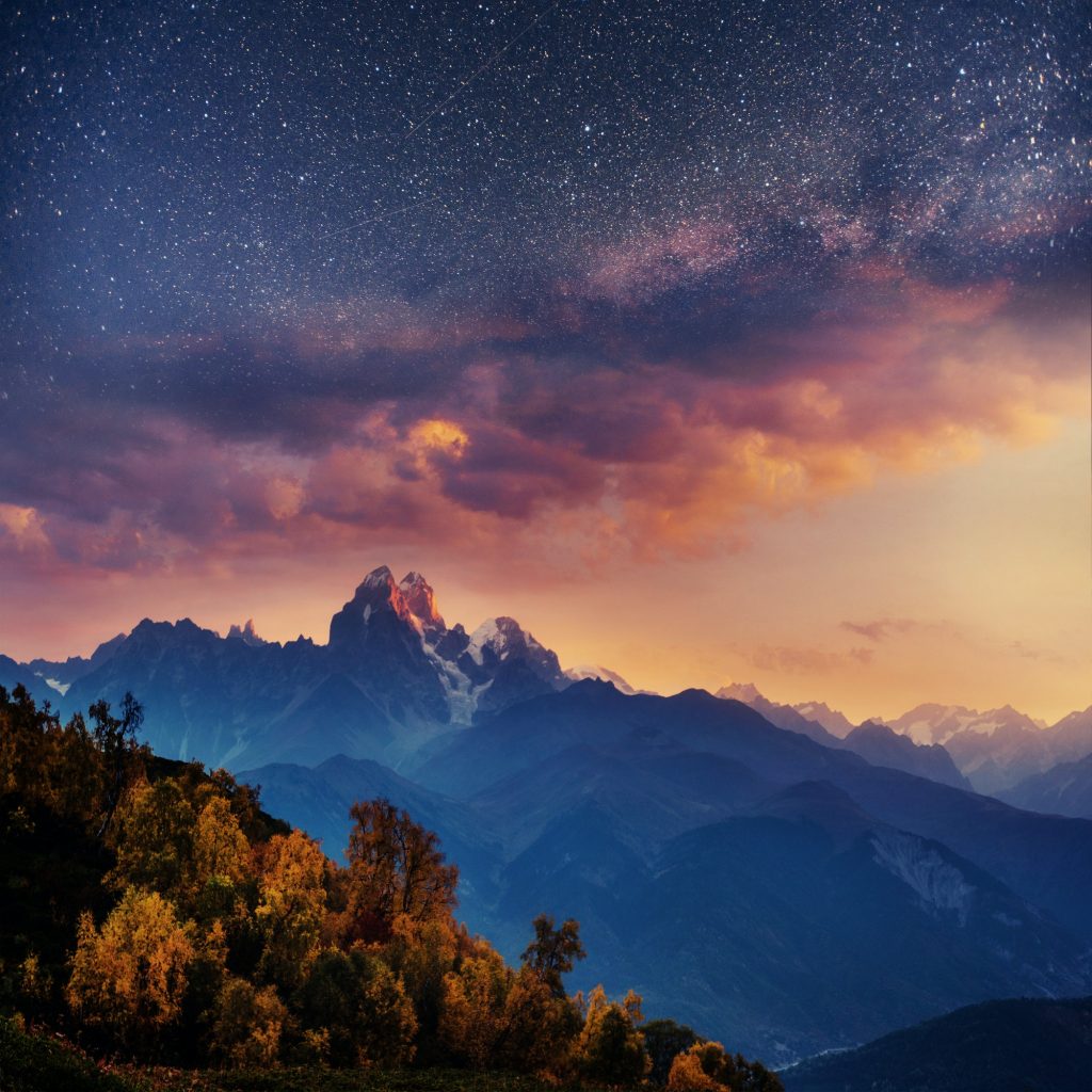 Snow-covered mountains in the mist. Autumn at Koruldi Lake